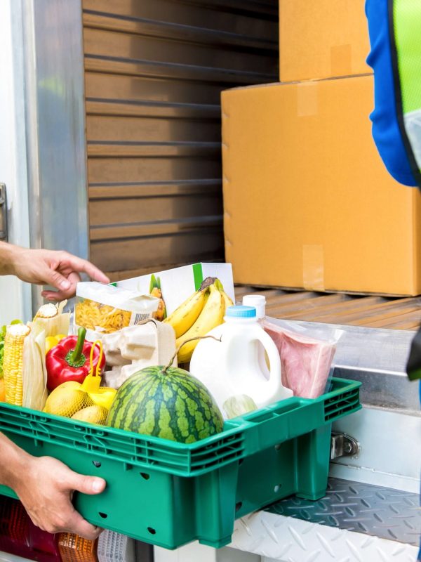 delivery-man-checking-food-before-taking-out-from-car-about-deliver (1) delivery-man-checking-food-before-taking-out-from-car-about-deliver (1)